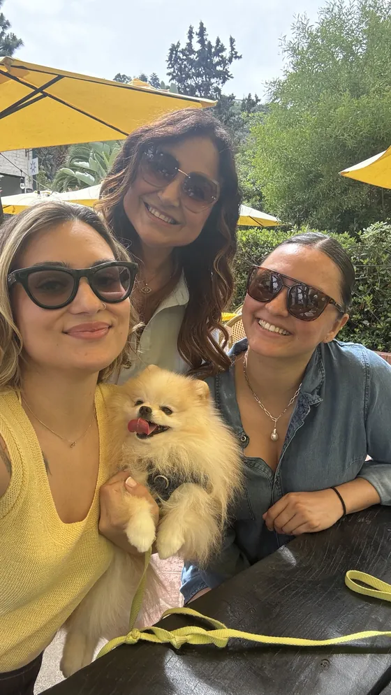 Three women and a Pomeranian at the first hi. South Bay brunch